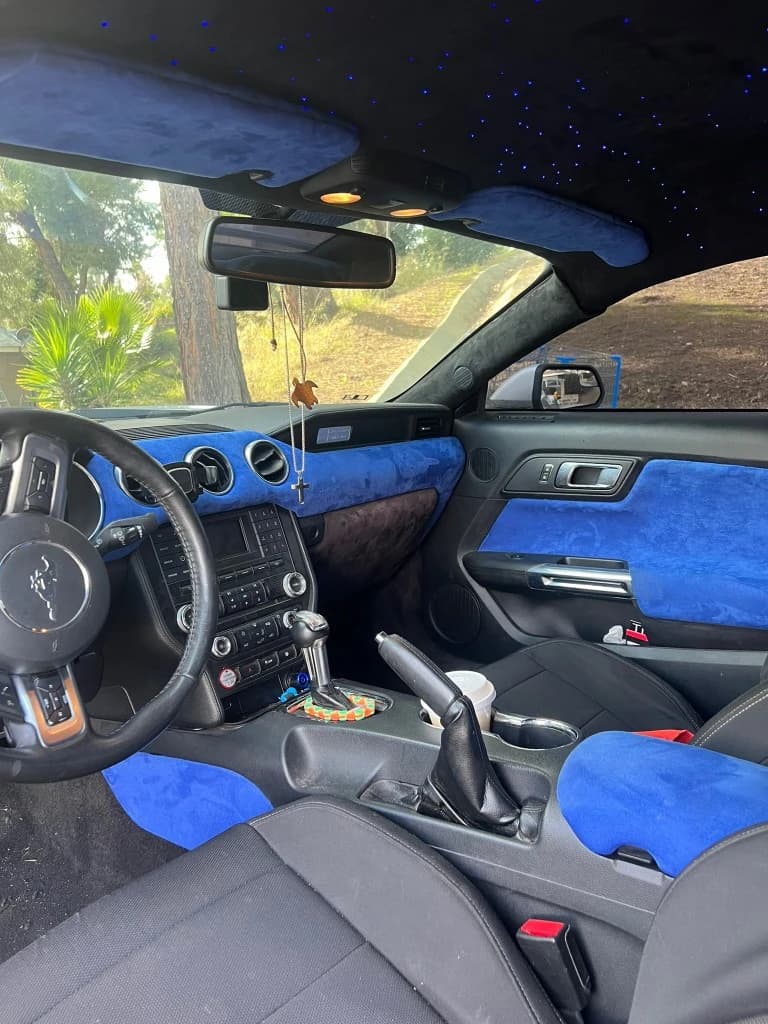 Ford Mustang interior with blue suede trim and starlight headliner