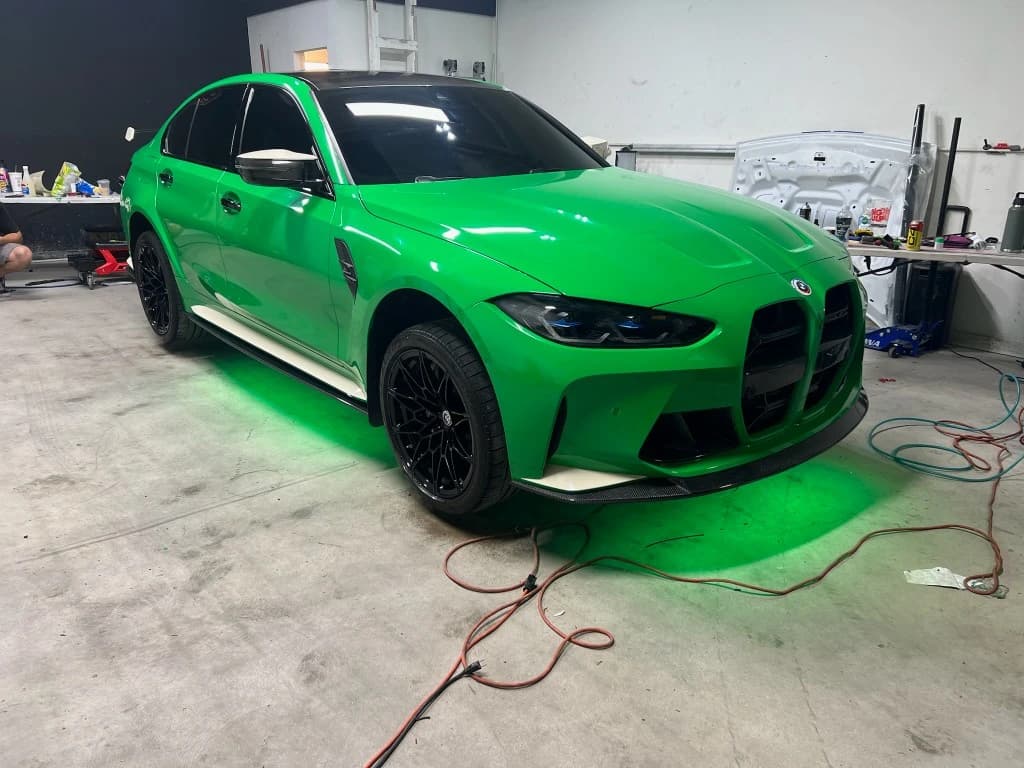 Neon green gloss vinyl wrap on a BMW M3