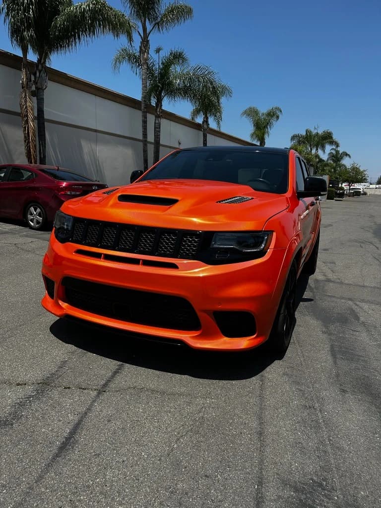 Orange gloss vinyl wrap on a Jeep Grand Cherokee