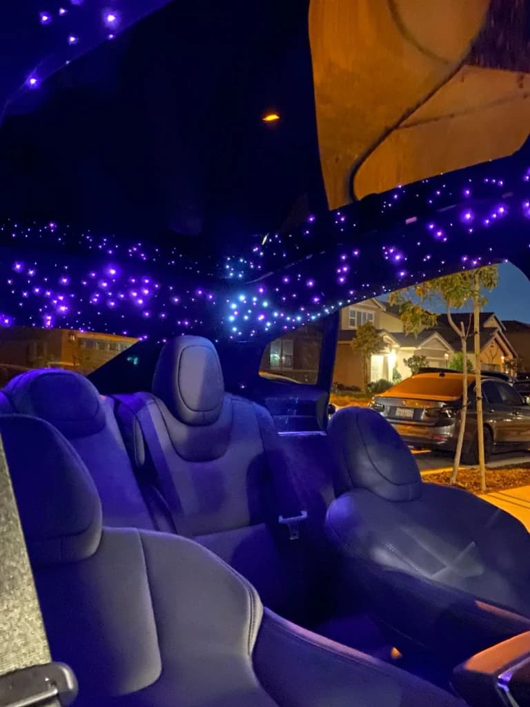 Purple and cyan starlight headliner at night