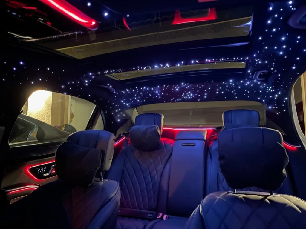 Mercedes starlight headliner with red ambient lighting