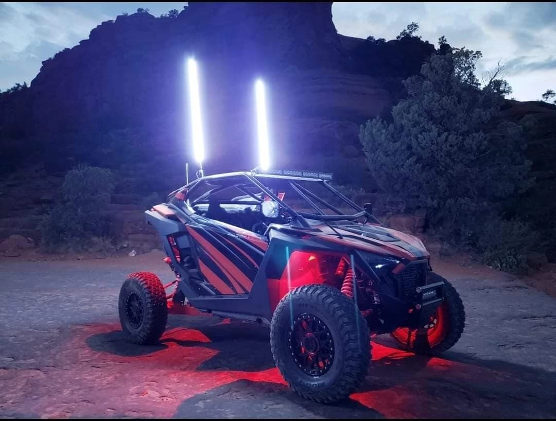 Side-by-side UTV with LED whip lights